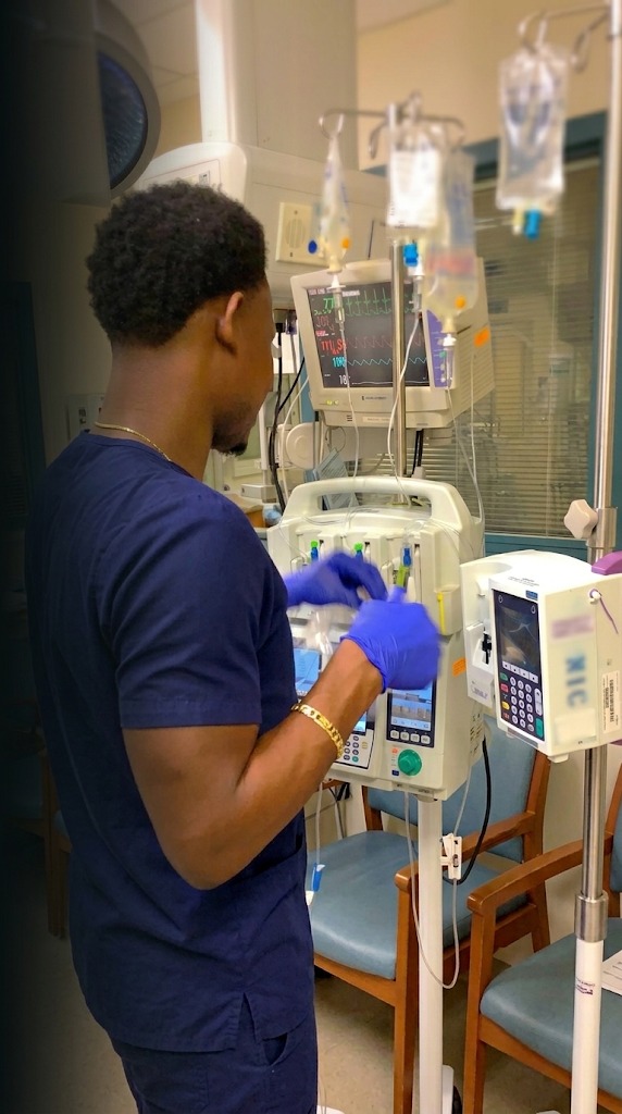Nurse in scrubs representing the RNroadmap study path